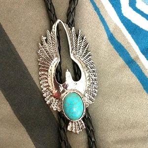 New eagle silver in color bolo tie with four turquoise stone